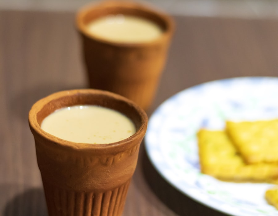 Kulhad chai in clay cups with biscuits