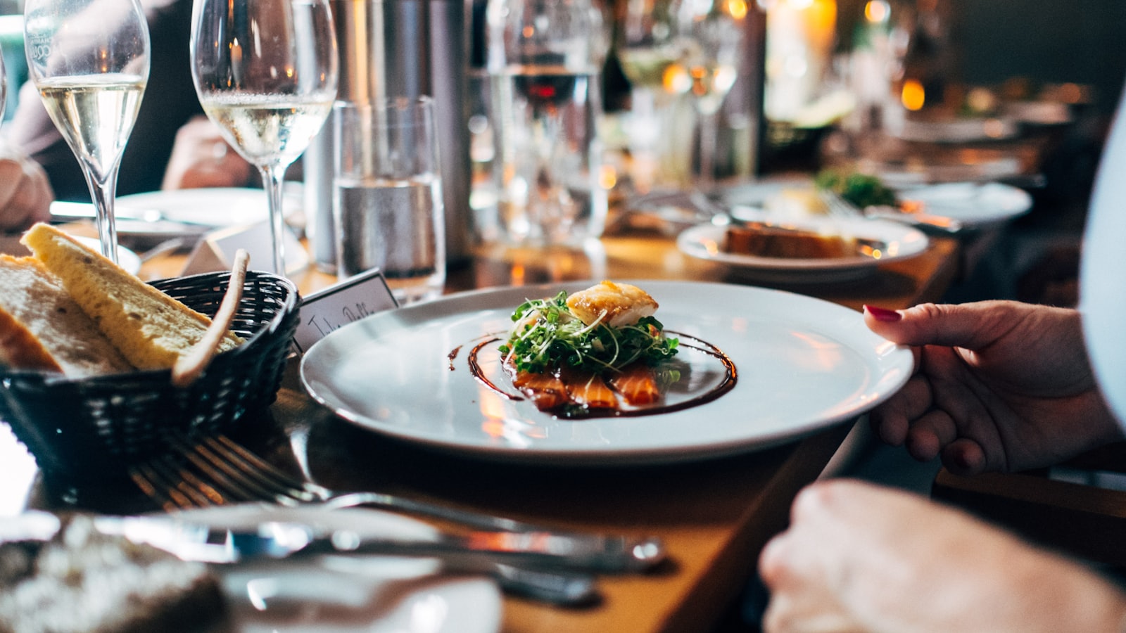 Warm candle-lit dinner table at the Wyra Road flagship