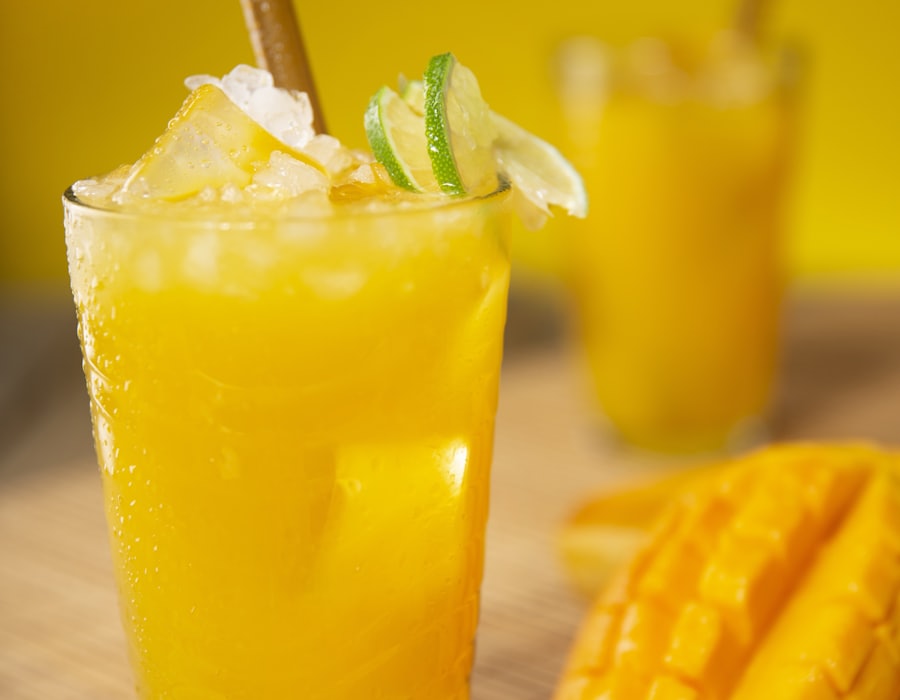 Fresh mango juice over ice with lime